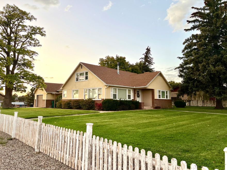 Welcome to this beautifully maintained 5-bedroom, 2-bath home filled with charm, character, and modern comfort. From the white picket fence and mature shade trees to the bright, airy interior, this home offers timeless appeal and thoughtful updates throughout. Enjoy refreshed bathrooms, upgraded plumbing, a cozy woodstove fireplace, new roof, updated furnace, added central air, and abundant natural light through updated windows. Every detail reflects care and pride of ownership, making this home truly move-in ready-a perfect blend of classic style and modern convenience. Square footage figures are provided as a courtesy estimate only and were obtained from CubiCasa . Buyer is advised to obtain an independent measurement.