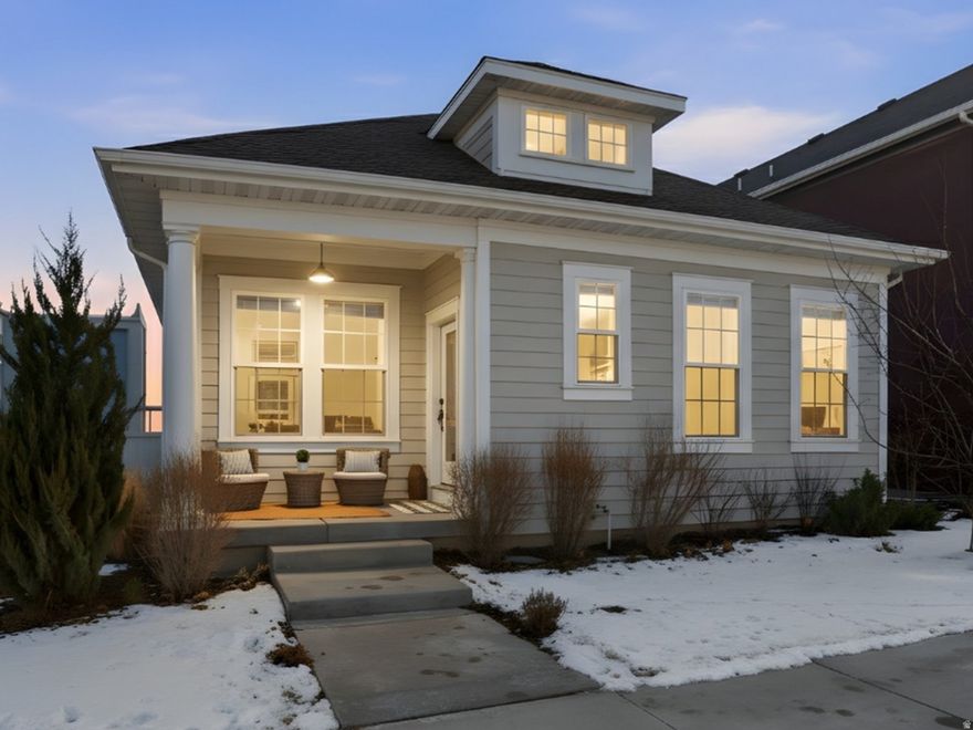 Located in Daybreak community in South Jordan, just steps from Highland Park and scenic walking and biking trails, this beautifully appointed rambler was built in 2022 by David Weekley Homes and includes a fully finished basement completed by the builder. Situated on a corner lot, the home offers open-concept, true single-level living with upgraded kitchen appliances, including a gas range, two-tone white and oak cabinetry with a contemporary aesthetic, brass hardware, and refined design details throughout. The gourmet kitchen serves as the heart of the home, featuring an extended sink-free island ideal for cooking, gathering, and entertaining. The spacious primary suite fits a king-size bed and sitting area. It is a private retreat with a spa-like ensuite bathroom and a spacious walk-in closet. The primary bathroom features dual sinks, a water closet, and an euro standing shower. The oversized garage features ceilings over 18 feet high, providing exceptional storage capacity to replace the need for off-site storage solutions. The fully finished basement includes a generous open area that can be divided into a living room plus a fifth bedroom, private office, or versatile flex space for guests. Meticulously maintained, the residence blends modern luxury style with everyday comfort in a layout that is both functional and elegant. Designer finishes, quality craftsmanship, and an extended floor plan create a seamless flow suited for both daily living and hosting. Enjoy the unmatched Daybreak lifestyle with access to parks, trails, pools, a lake, and year-round community events-making this one of Utah's most desirable master-planned communities. Square footage figures are provided as a courtesy estimate based on county records. Buyer is advised to obtain an independent measurement.