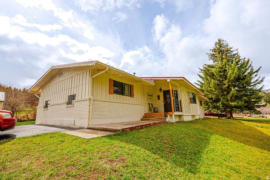 Spacious country living meets everyday convenience in this impressive 6 bedroom, 3 bath home offering just over 3,000 sq ft of living space. Situated on 3 acres, this property provides the perfect balance of privacy and accessibility- close to town, yet far enough out to enjoy peaceful, rural living. Inside you'll find a generous layout with plenty of room for family, guests or home office set up. Stay cozy year round with two wood burning stoves for warmth and charm. Property has a full set up for animals, plus a SHOP for all your hobbies and a detached storage garage. Endless opportunities!! Whether you're looking for a hobby farm, space to grow or room to breath this property offers is all. Call today for your private showing