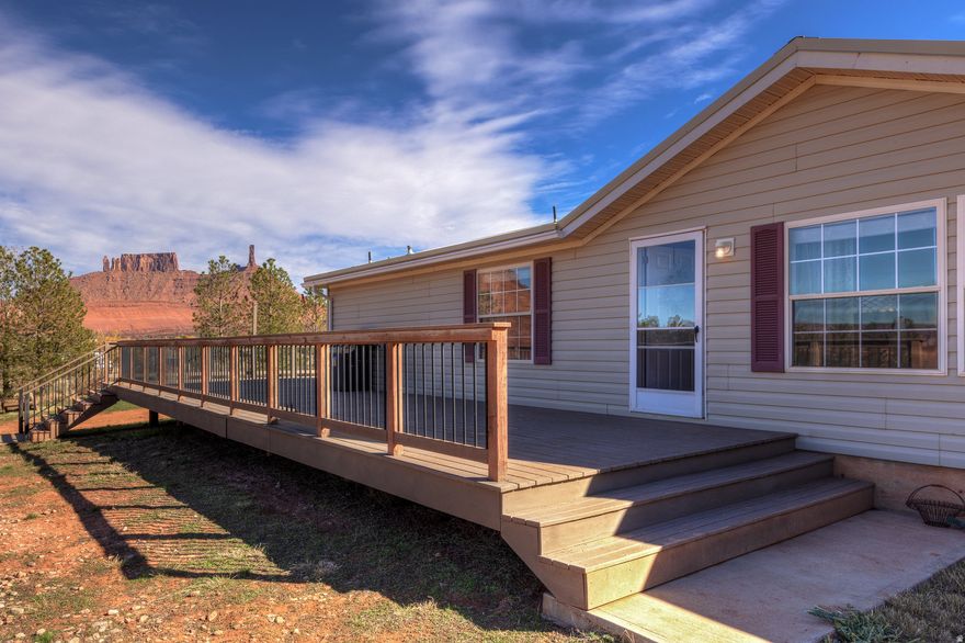 Discover the best of country living with this well-maintained 3-bedroom, 2-bath home set on 3.9 acres of open land with unobstructed 360-degree views. Enjoy the peace and privacy of a fully fenced property with deer-proof fencing-perfect for animals and gardens. The property features a barn with lean-to for hay storage and animal rights, ideal for horses, livestock, or hobby farming. Relax or entertain on the spacious wrap-around deck and take in incredible sunrises and sunsets from every angle. This cozy home combines comfort, function, and natural beauty-a rare find with room to grow. Square footage figures are provided as a courtesy estimate only and were obtained from county records. Buyer is advised to obtain an independent measurement.