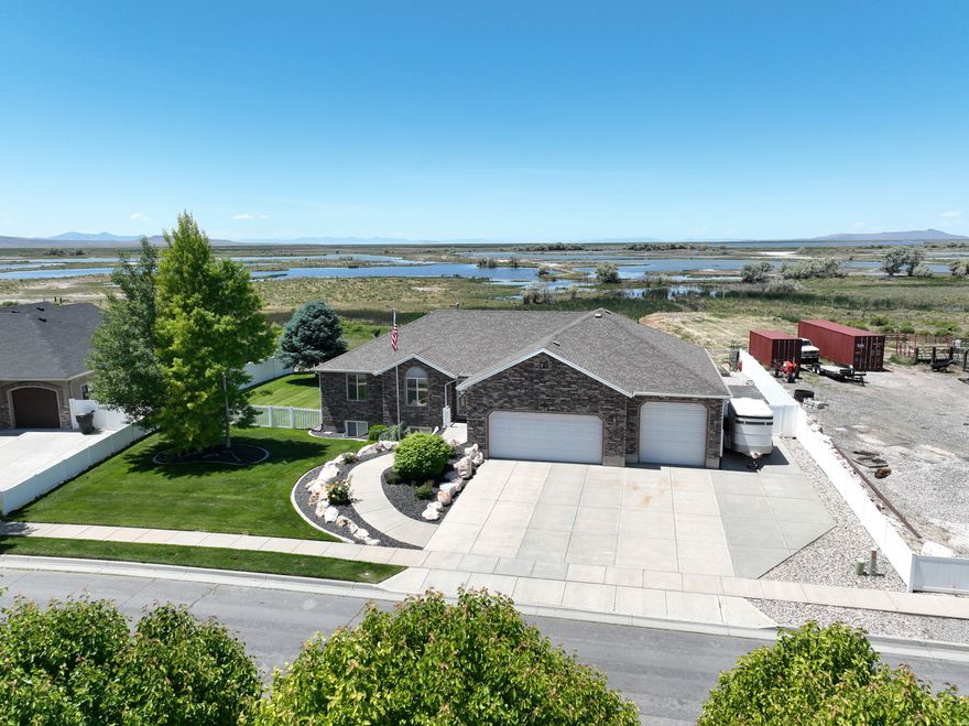 Unique Location with no backyard neighbors and stunning views of antelope island! Views that will take your breath away! Wildlife of all kinds frequent the area and allow for quiet peaceful evenings! Beautiful BRICK Rambler! . Fireplaces up and down will allow for comfort during the winter months. All HVAC units have been replaced or serviced. Established neighborhood with mature landscaping and a finished basement! Gas Fireplace in basement adds a lot of heat in the basement family room! Home has a covered walkout basement with RV Parking that allows easy access to the basement. Summer BBQs on your covered deck as you watch the summer storms arrive with a front row view. Yard is fully fenced allowing your pets to roam freely. Lots of possibilities in the garage room area seen in the photos. 220 Power in garage! Call to view this super maintained home in a rare opportunity location!