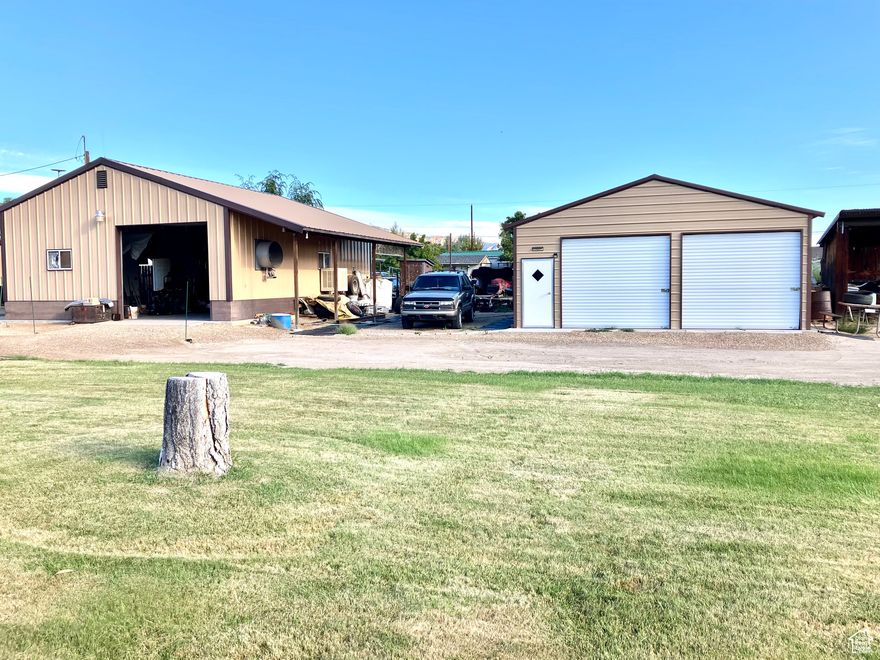 This 3 bed, 1.75 bath home sits on a large .6 acre lot and comes with 2 garages for 6 cars or a bunch of toys. The large 4 car garage is fully insulated, heated and cooled for the year round hobbyist and even comes with a built-in compressor and equipped for automotive painting. The 2-car garage with loft storage is equipped with a pulley lift system. The home and yard have been very well maintained. The home even has a new metal roof.