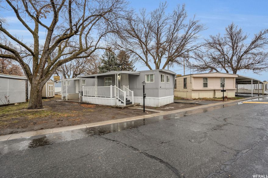 Exceptionally clean, fully remodeled 2-bedroom, 1-bath home located in the quiet and well-established American Heritage Retirement Community, a desirable 55+ park known for affordability and convenience. One of the lowest monthly lot fees in Salt Lake County, ideal for buyers seeking predictable, low-overhead living. The home features brand-new flooring, countertops, and fresh paint throughout, along with a newer furnace and central AC. Includes new washer, dryer, and refrigerator-truly move-in ready. Situated on an extra-large lot with ample outdoor space and a durable wood storage shed. A great option for downsizing, full-time living, or long-term retirement where location and cost matter. Seller financing considered; financing assistance available. Square footage provided as a courtesy estimate only. Buyer to verify all.