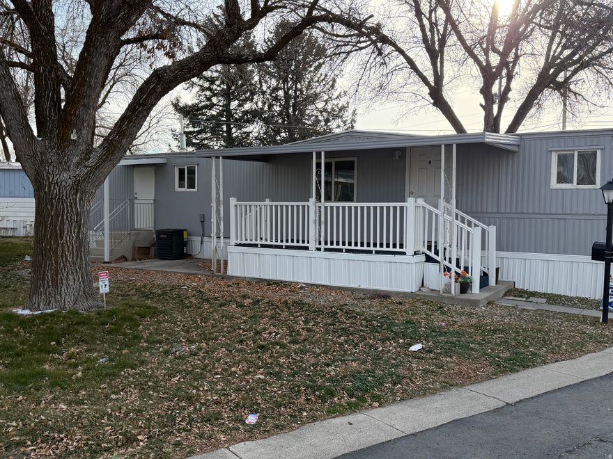 Exceptionally clean, fully remodeled 2-bedroom, 1-bath home located in the quiet and well-established American Heritage Retirement Community, a desirable 55+ park known for affordability and convenience. One of the lowest monthly lot fees in Salt Lake County, ideal for buyers seeking predictable, low-overhead living.  The home features brand-new flooring, countertops, and fresh paint throughout, along with a newer furnace and central AC. Includes new washer, dryer, and refrigerator-truly move-in ready.  Situated on an extra-large lot with ample outdoor space and a durable wood storage shed. A great option for downsizing, full-time living, or long-term retirement where location and cost matter.  Seller financing considered; financing assistance available. Square footage provided as a courtesy estimate only. Buyer to verify all.