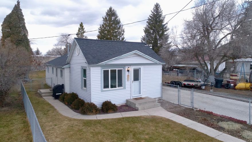 This Quaint Home is RENOVATED and Calling Your Name! Would Make for a Great Starter Home, Retirement Home or Investment Property! You're Sure to Enjoy the Large Fenced-In Yard with a Ground-Mounted Barrel BBQ, Storage Shed, Garden Area, and Established Lawn with Lilacs, Rose Bushes and Shade Trees Keeping the Area Cool and Vibrant. The Long Driveway Offers Direct Access to the Backyard and Great Parking Space. Could Possibly Fit an RV too! The Home Offers a New Roof, Heat Cords in the Gutters, Updated Electrical and Lighting, New Carpet and Tile Entrance in the Living Room, New Vinyl Windows, 2 New Exterior Doors, Newly Renovated Bathroom, Pantry Closet, Laundry/Mud Room, and Separate Storage Room. It Has a Good Amount of Storage Space too! This Home's Central Location in Town Near the Middle School, Fuel and Shopping Make this a Great Option for People who Like to Live a Walkable Distance to all the Activity of Town. Call Listing Agent Today to Schedule Your Private Showing!