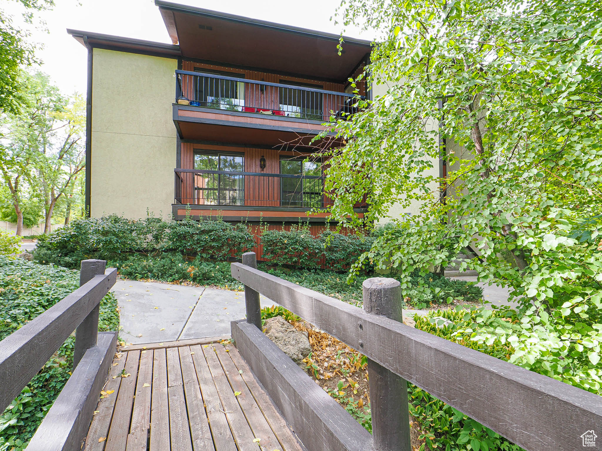 Welcome Home to this Spacious Condo! Large Great room & dining area, full kitchen with pantry. 2 large bedrooms with baths. Laundry/Office Area, Enjoy great views off of the delightful deck. Private, secure garage located under unit includes a work area & storage. Enjoy the walkways through lush trees. Super close to pool and plenty of guest parking. Convenient Location.