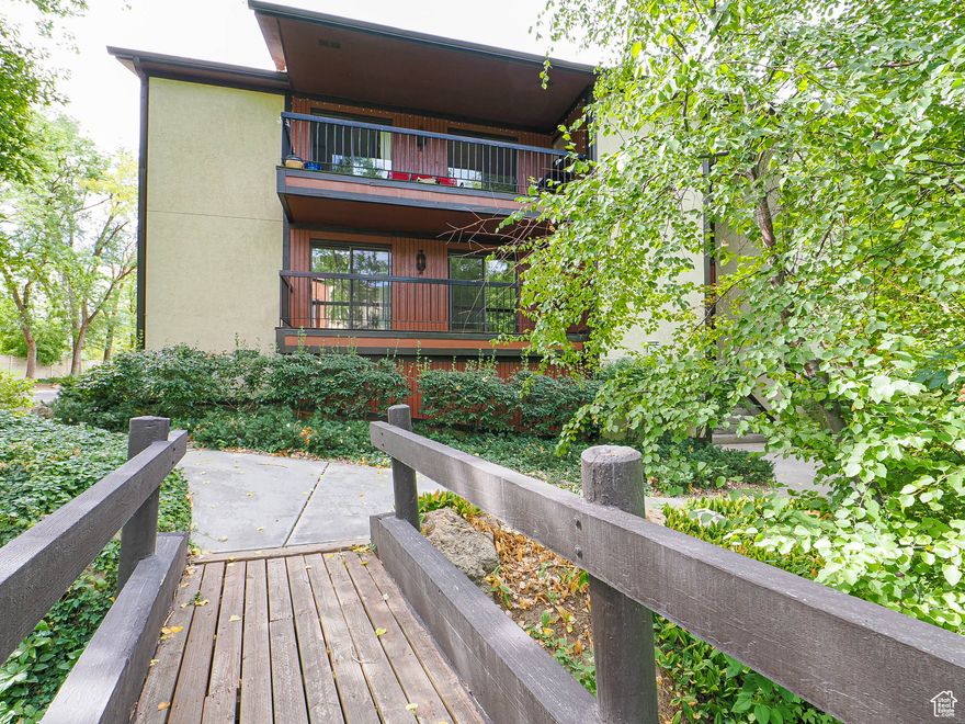 Welcome Home to this Spacious Condo! Large Great room & dining area, full kitchen with pantry.  2 large bedrooms with baths. Laundry/Office Area, Enjoy great views off of the delightful deck.  Private, secure garage located under unit includes a work area & storage. Enjoy the walkways through lush trees. Super close to pool and plenty of guest parking. Convenient Location.