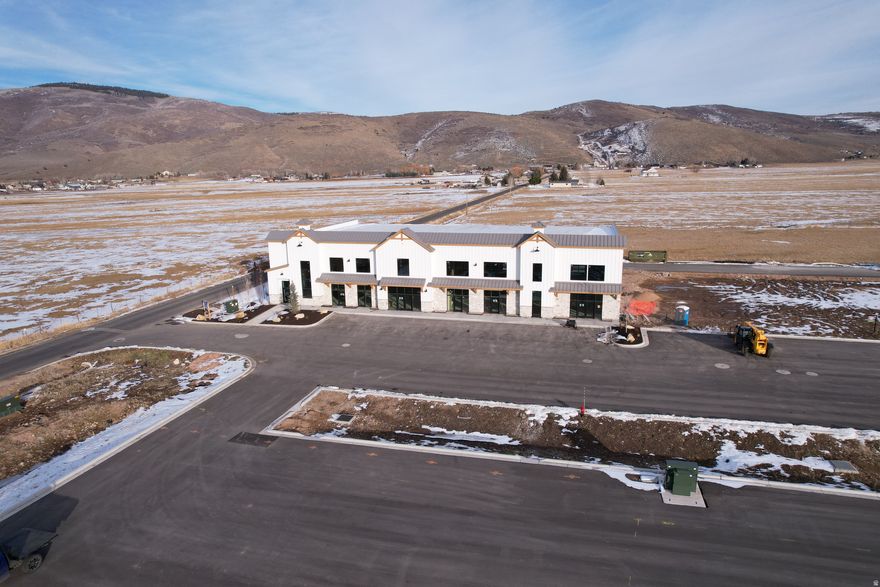 Discover an exceptional opportunity to secure a .79-acre pad-ready commercial building lot within the highly desirable Route 32 Project-one of the fastest-growing commercial corridors in the Kamas Valley. This site is fully improved and ready for immediate development, offering unmatched convenience, visibility, and long-term value for any owner-user, investor, or business looking to establish a presence in a thriving market. This premium lot comes fully prepared with all utilities already stubbed, including power, water, sewer, and fiber, significantly reducing both cost and timeline to build. With level topography, engineered soils, and direct access from Route 32, the site is perfectly suited for office, flex, retail, light commercial, or mixed-use applications. Positioned within a master-planned flex campus featuring high-quality construction, modern architecture, and professional neighboring businesses, this parcel benefits from excellent traffic counts, strong local demographics, and year-round activity from recreation, tourism, and full-time residents. Whether you're expanding your commercial footprint or looking for a strategic long-term asset, this lot offers the rare combination of readiness, location, and future upside-all within one of Utah's most supply-constrained markets.  .79 acres , pad-ready and fully buildable Engineered pad with level, compacted soils. Fast-growing area with strong demand and limited commercial inventory. Excellent visibility and accessible directly from Route 32 All utilities onsite and stubbed (power, water, sewer, fiber) Ideal for flex, office, retail, or light commercial Part of the upscale Route 32 flex campus