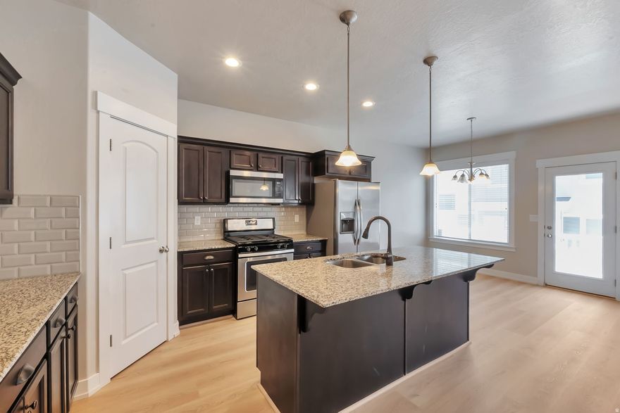 Wow-this beautiful 3-bedroom, 3-bath townhome offers the perfect blend of comfort, convenience, and value, all at a new price! Featuring brand new carpet and stylish new LVP flooring, the home feels fresh, modern, and truly move-in ready. Bright and inviting living spaces are filled with natural light, creating a warm and welcoming atmosphere throughout. The unfinished basement provides incredible potential to customize-add a spacious family room, a 4th bedroom, or whatever suits your lifestyle. Ideally located in the heart of Lehi with quick freeway access, commuting is a breeze, and you're just minutes from top shopping, dining, entertainment, and the new Primary Children's Medical Center. Enjoy fantastic community amenities including a clubhouse, pool, and pickleball courts. If you're looking for a quick move-in home in a thriving, convenient area, this one checks all the boxes!
