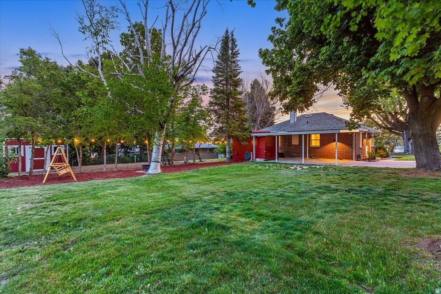 This charming brick bungalow in North Ogden offers comfort, character, and a beautiful setting. Surrounded by mature trees on a spacious lot, the property provides a peaceful, quiet atmosphere with incredible mountain views right outside your door.  Inside, you'll find an inviting and cozy layout with thoughtful updates throughout. This well-loved and carefully maintained home features new paint, new flooring, new light fixtures, updated windows, and improvements to the furnace, air conditioner, and electrical system-offering both comfort and peace of mind. The home includes two bedrooms with the potential for a third, along with abundant storage that adds to its everyday functionality.  Step outside to a large backyard with plenty of room to relax, garden, or entertain, along with a Tuff Shed for additional storage or workspace, plus two additional storage sheds attached to the carport.  Located in a well-established neighborhood known for its magnificent mountain and sunset views, this home is also just minutes from shopping, dining, and outdoor recreation, offering easy access to everything North Ogden has to offer. Ready to provide lasting memories for its next owner, this is one you won't want to miss.