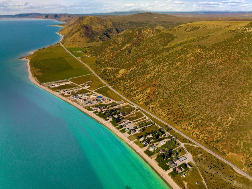 ONLY 5 LOTS REMAIN! Experience the exclusive lifestyle of Eden Ranch, Bear Lake's premier gated lakeside community, located on the serene east shore of northern Utah's stunning Bear Lake-often called "The Caribbean of the Rockies" for its crystal-clear turquoise waters and sandy beaches.  Located in the heart of a region known for its four-season recreation, with easy access, you can enjoy your retreat year-round. This exclusive waterfront community features 36 large 1+ acre home sites. Each lot offers sunset views of Bear Lake and the majestic Cache Mountains. Thanks to a unique topography on the southeast shore, residents enjoy one of the most consistent, usable beach on the lake regardless of water levels, complete with private boat ramp access. Bordered to the north by historic South Eden Ranch's 100+ acres of working farmland and to the west by Bear Lake itself, this sanctuary is both private and open. Just minutes away from the charming towns of Bear Lake Valley, offering dining, shopping, golf, and the area's famous raspberry shakes.  Close enough for convenience, yet far enough that you can get away from the weekend bustle and enjoy some peace and quiet. Private gated community with beach access, boat ramp, high-quality Artesian well water, high speed fiber optic internet, pavilion, tennis, basketball, and pickleball courts. Buyer to verify all information. Agent Related to Seller.