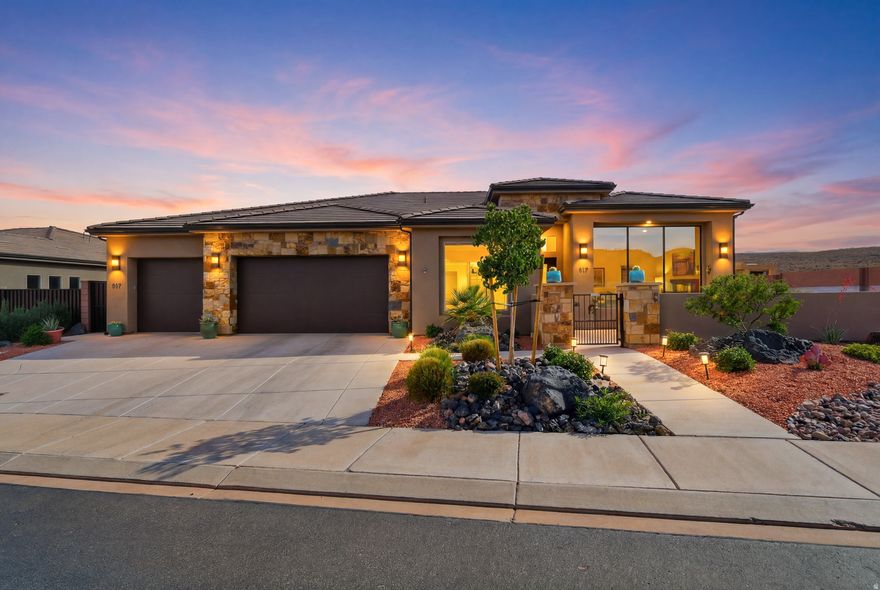 Located in the heart of Ivins, this beautifully designed 4-bedroom, 3-bathroom home offers 2,419 sq ft of thoughtfully crafted living space surrounded by some of Southern Utah's most breathtaking scenery. Nestled within a quiet, well-kept neighborhood, this property combines comfort, functionality, and stunning views into one incredible opportunity.  From the moment you arrive, the inviting courtyard, low-maintenance landscaping, and unobstructed views of the iconic Ivins red mountains create a warm and memorable first impression. Inside, soaring ceilings and an open-concept floor plan provide a spacious, light-filled atmosphere filled with high-end finishes throughout. Large front living room windows perfectly frame the breathtaking red mountain views while bringing in an abundance of natural light that enhances the home's inviting feel.  The chef-inspired kitchen is both stylish and functional, featuring quartz countertops, high-end appliances, abundant cabinetry, a spacious pantry, and a dry bar-perfect for entertaining or everyday living. The open living area is highlighted by a cozy gas fireplace, creating the ideal space to relax or gather with family and friends.  The luxurious primary suite offers a peaceful retreat with a double vanity, oversized walk-in closet, and thoughtfully designed finishes throughout. Additional features include built-in office cabinetry, dual-zoned AC units for year-round comfort, epoxy-coated garage floors, and permanent exterior lighting that adds beauty and convenience year-round.  Step outside to a fully enclosed backyard designed for low-maintenance enjoyment, complete with turf, gravel, and mature plants, creating a private outdoor oasis. The oversized 3-car garage, RV parking, and additional outdoor parking provide ample space for vehicles, toys, trailers, and recreational gear.  Located just minutes from hiking and biking trails, Tuacahn, Snow Canyon State Park, and all that Southern Utah outdoor living has to offer, this home delivers the perfect blend of luxury, scenery, and practicality.  Buyer to verify all information, deemed reliable, however buyer to verify all information including utilities, rental restrictions, and HOA information if applicable.