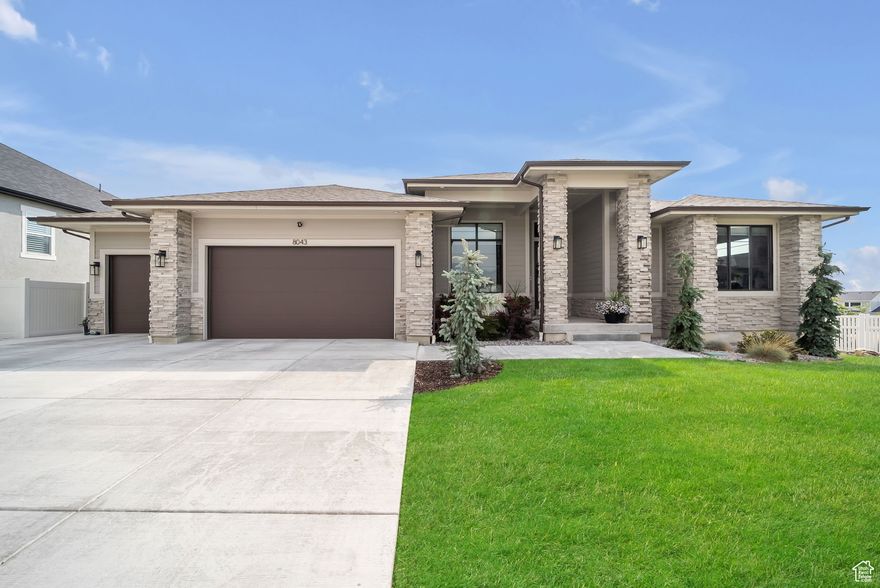 Don't miss this gem of a home in the beautiful Orchard Heights neighborhood. Fantastic open floorplan with lots of natural light. Step out into the large covered deck with magnificent views-when looking to the east from the back deck you see the Wasatch Mountains and from the front porch you see the Oquirrh Mountains. Many upgrades throughout and classy interior design and finishes! Galley kitchen with oversized island bar, butler's pantry, and large dining nook.  Owner's suite with tray ceiling, walk-in shower, oversized garden tub, and huge walk-in closet. You'll love entertaining in the finished basement with family room/game room and attractive wet bar. This home features a High Energy Whole House Fan system, which helps cut down on energy bills. Oversized covered patio. Community offers a swimming pool & playground and access to the Highlands Trail System.