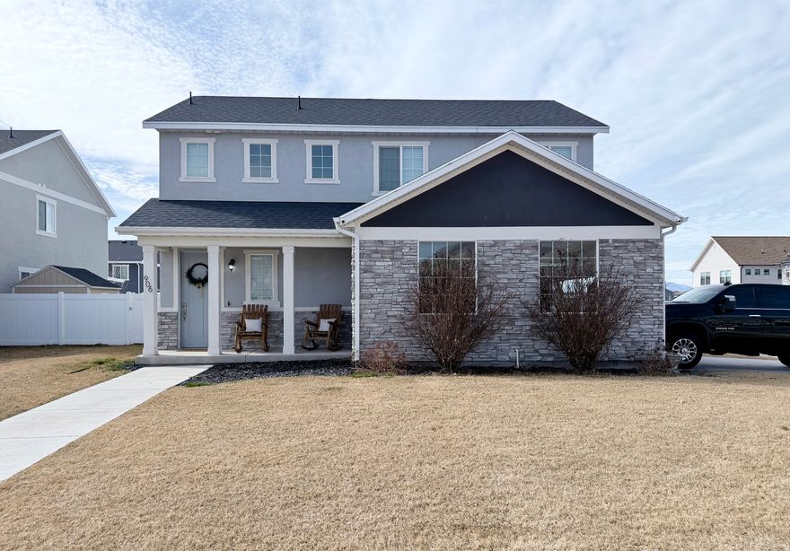 OPEN HOUSE SATURDAY 3/7 11:00 - 1:00.  Check out this beautiful 3-bedroom, 2.5-bathroom home situated on a desirable corner lot with a large, fully fenced backyard - perfect for entertaining, pets, or outdoor living. Located in a quiet neighborhood, this home features an EverLights year-round holiday lighting system and outdoor surveillance cameras for added convenience and peace of mind. Ideally positioned just two blocks from the elementary school and three blocks from JR High School, with close proximity to shopping, dining, and everyday amenities. Easy access to I-15 makes commuting simple and convenient.