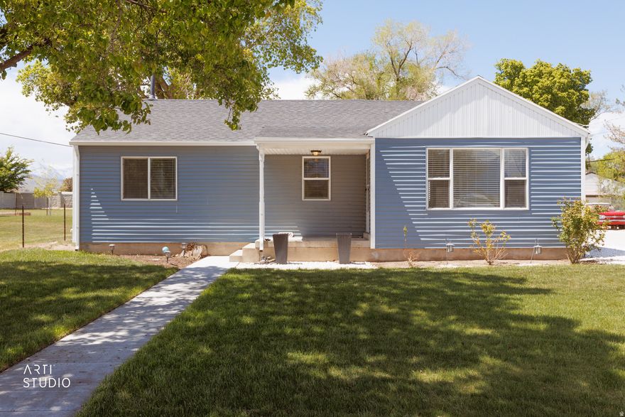 Discover a rare opportunity in the heart of Riverton this charming bungalow sits on nearly half an acre with unmatched versatility and access. Inside, you'll find a bright, welcoming living space filled with natural light, complemented by modern recessed lighting, plush carpet, and a remodeled kitchen featuring custom wood cabinetry, sleek countertops, and stainless steel appliances. The home offers three comfortable bedrooms, including a spacious primary suite.  Where this property truly stands apart is outside. The expansive lot provides endless possibilities whether you're looking for space to entertain, expand, or operate. A standout feature is the large, all-steel garage/shop built in the 1950s-engineered to last generations. This structure offers incredible flexibility for: A workshop or hobby space Storage for equipment, toys, or vehicles Small business use, including parking work trucks or service vehicles  With direct access to Redwood Road, a major thoroughfare, the property offers exceptional convenience and visibility ideal for those needing easy in-and-out access for business or daily life. Mature trees provide privacy and shade, while the oversized lot creates a rare blend of residential comfort with functional utility. Located near schools, parks, and amenities, this property delivers space, access, and opportunity-all in one. Homes with this kind of lot size, shop infrastructure, and road access don't come around often.