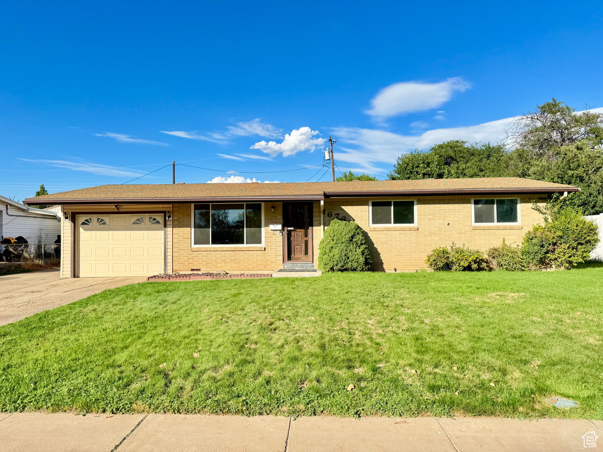 Welcome to this beautifully updated 3-bedroom, 1-bath home in the heart of Layton! Located in a desirable neighborhood near top-rated schools, Hill Air Force Base, Layton Hills Mall, and major commuter routes, this home offers both convenience and comfort. Featuring 980 sq ft of single-level living, this home boasts a spacious open floor plan with modern LVP flooring and quartz countertops. The kitchen flows seamlessly into the main living space, offering an inviting area for entertaining or relaxing. Stay comfortable year-round with efficient central air conditioning that blows cold and a reliable furnace for those chilly winter months. A water softener system helps support healthier water quality and extends the longevity of your appliances. Outside, enjoy a fully fenced backyard equipped with a secondary water sprinkler system-perfect for low-cost summer maintenance and beautiful full lawns. Get away and get your favorite projects done in this giant beautiful rare oversized, tall 2-car detached workshop. Ideal for hobbyists, personal projects, storage, or even a home business. Imagine the sunsets from here and make this your home! Square footage figures are provided as a courtesy estimate only and were obtained from county records. All information has been provided as a courtesy only.