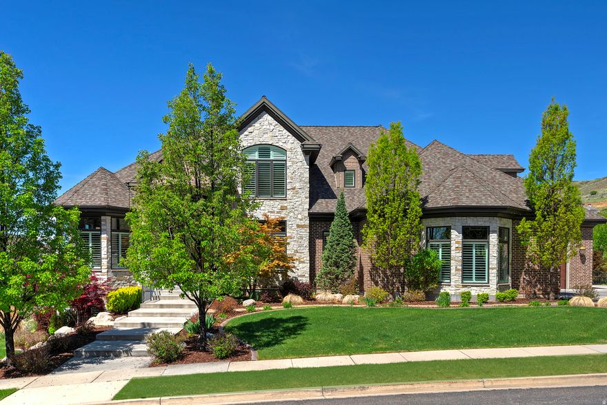 Welcome to this exquisite luxury residence in picturesque Alpine, Utah. This stunning 9,700+ sq ft home is a true masterpiece, combining elegance with modern amenities to create an unparalleled living experience. As you enter this magnificent property, you are greeted by soaring ceilings and an open-concept layout . The grand foyer leads to a spacious living area adorned with high-end finishes, custom cabinetry, and large picturesque windows that flood the space with natural light offering breathtaking views of the surrounding mountains. The gourmet kitchen is a chef's dream, featuring top-of-the-line appliances, a generous island, and exquisite stone countertops, perfect for entertaining guests or enjoying family meals. Adjacent to the kitchen is an elegant dining room that provides a sophisticated atmosphere for formal gatherings. The opulent primary suite is a serene retreat, featuring a spa-like ensuite bathroom with a soaking tub, an oversized walk-in shower, dual vanities, and a spacious walk-in closet. The 2nd floor offers additional bedrooms which are generously sized and each offers its own unique charm, ensuring comfort for family and guests alike. Also on the 2nd floor is a bonus room great for gaming, crafting or an out of the way playroom. For leisure and entertainment, this luxury home boasts an impressive indoor basketball court with solid hardwood floors, allowing for year-round sports and fun. Additionally, the state-of-the-art movie theater offers a cinematic experience right at home, complete with plush seating and the latest technology for film enthusiasts. Step outside to discover beautifully landscaped grounds, a spacious covered deck and patio areas and outdoor living spaces that are ideal for hosting gatherings or simply relaxing while taking in the stunning views of nature. This home is not just a residence; it is a lifestyle of luxury, comfort, and sophistication, making it the perfect sanctuary for those who appreciate the finer things in life. Square footage figures are provided as a courtesy estimate only. Buyer is advised to obtain an independent measurement.