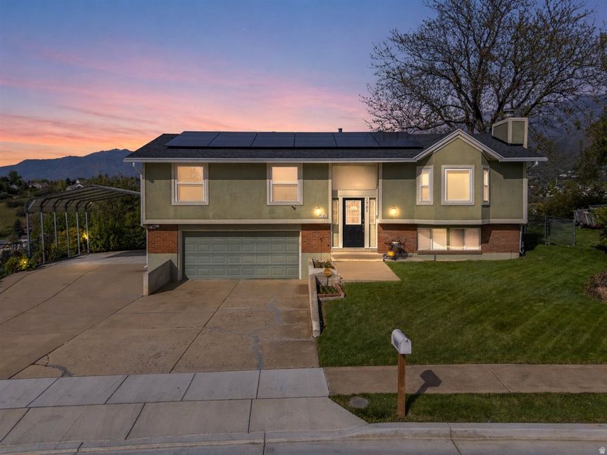 Beautifully maintained home in a prime Layton location just off Cherry Lane with quick access to Highway 89 and Interstate 15, close to Hill Air Force Base, shopping, dining, and hospitals. Enjoy stunning mountain and valley views from the deck, perfectly positioned for morning sun and afternoon shade.  Updated in 2012, the home features granite countertops, soft-close cabinets, and a well-cared-for interior throughout. Major systems have been updated, including roof, furnace, and A/C (4 years old) and water heater (6 years old). Many upstairs windows have been recently replaced for added efficiency. Paid-off solar panels provide added energy savings.  Fully fenced backyard and easy access to nearby hiking and biking trails complete this move-in ready home in a highly desirable area.   Square footage figures are provided as a courtesy estimate only and were obtained from county records.  Buyer is advised to obtain an independent measurement.