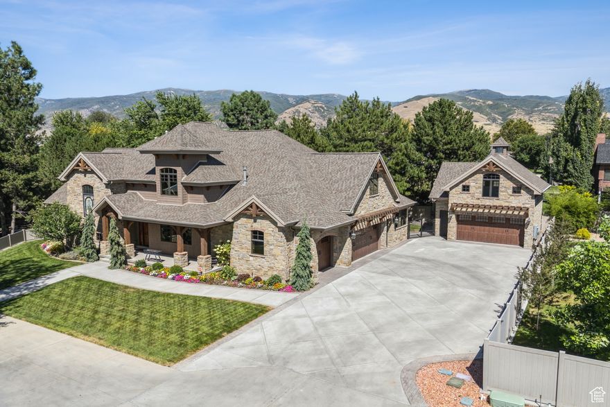 This elegant home designed by Robert McArthur is a hidden gem nestled in a tranquil neighborhood. Step inside this old-world style home and experience exquisite European styling and high-end finishes throughout. As you enter, you're welcomed into a peaceful retreat that feels worlds away from the everyday. The main level features a beautiful office with built-in desk, custom shelving, a warm fireplace that's perfect for working from home. The open-beamed great room flows seamlessly into an outstanding gourmet kitchen, complete with stunning walnut cabinets,  2 Sub-Zero refrigerator/freezers, a WOLF gas range and 2 Wolf wall ovens. Custom made "Lion from Narnia" door  leads to a fun play area for the kids! The main-level primary suite boasts high ceilings, large windows, a cozy gas fireplace. The luxurious en-suite includes dual vanities, steam shower and a huge walk-in closet with its own washer and dryer. An elegant open staircase leads to a spacious landing with built-in library shelves and a music/reading nook. As you follow the stairs up you're greeted to an open, vaulted family/movie room with soaring windows. Fun built-in wet bar, drink refrigerator and room for popcorn!  The spacious bedrooms each have en-suite bathrooms, including a unique bunk room with four built-in beds and plenty of play space. The main-level laundry and craft room offers built-in shelving, gift wrapping station and desk. The 2nd detached garage features a loft above-ideal for a man cave, art studio, or more (check with Donna for city-approved uses). Enjoy the amazing back patio with a custom pergola, built-in gas fire pit, WOLF gas grill, and beautiful pine trees. Don't miss the charming fairy garden tucked behind the 2nd garage. Additional storage includes space under the main level (accessed from the garage) and two spacious upper-level storage rooms with built-in shelving. This home also features automated trim lighting for added ambiance for the holidays! *The room above the detached garage is approximately 535 sq ft and is reflected on the 3rd level square footage on the MLS* Square footage figures are provided as a courtesy estimate from the builder; buyers are advised to obtain an independent measurement. BE SURE TO CLICK ON THE VIDEO AND 3-D TOUR TO EXPERIENCE THIS STUNNING HOME!  Square footage figures are provided as a courtesy estimate only and were obtained from builder. Buyer is advised to obtain an independent measurement.