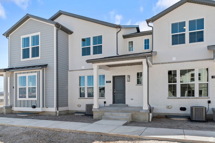 Discover the modern charm of the Bellevue Townhome all in a great Lehi community! This thoughtfully designed home includes durable laminate hardwood, vinyl tile, and carpet flooring, along with energy-efficient features like a tankless water heater. The modern kitchen features sleek gray laminate cabinets, quartz countertops and stainless steel gas appliances. Additional highlights include a stylish half wall at the stairway, Craftsman base and casing, and an owner's bathroom with cultured marble shower surrounds and satin & brushed nickel hardware. Comes fully landscaped all near shopping, schools parks and more at a great price!