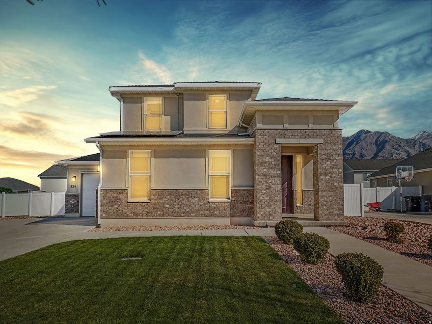 If you've been waiting for a home that actually checks all the boxes, this is it. Nestled in the sought-after Miners Grove community, this two-story charmer delivers the space, style, and lifestyle you've been looking for. The layout is both functional and inviting. The open main living area flows seamlessly from a stylish kitchen featuring granite countertops, rich wood cabinetry, and all appliances included, making it genuinely move-in ready from day one. Upstairs, comfortable bedrooms offer plenty of room to unwind, while the spacious main suite impresses with a walk-in closet and a private en-suite bath. The conveniently located upstairs laundry room comes complete with washer and dryer included.  Step outside to a large, fully fenced yard with a spacious deck, perfect for summer BBQs, evening hangouts, or simply soaking up the mountain views. The roomy three-car garage and ample parking mean there's space for all your vehicles, toys, and guests.  Bonus: solar panels will be paid off at closing, so you start saving on energy cost from the moment you move in. Just minutes from Clyde Recreation Center, parks, schools, shopping, dining, and freeway access, this home makes it easy to enjoy everything Springville has to offer. Use our preferred lender, Travis Lemmon at Creekside Mortgage and get a free appraisal & $1000 closing costs credit.