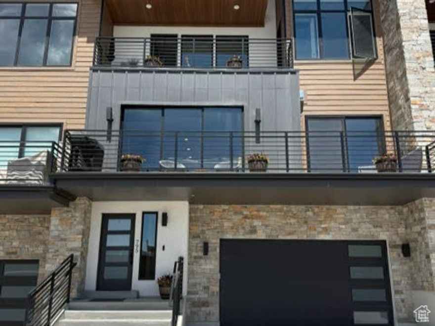 Imagine waking up to incredible views of Jordanelle Reservoir in this contemporary townhome  it's the perfect blend of modern luxury and a savvy investment. Every detail is considered, from the rich wood flooring and pristine quartz countertops to the effortless motorized blinds. The bright, open living space and fully stocked kitchen are ideal for everything from quiet evenings to lively gatherings. Step out onto one of the multiple decks to truly appreciate the captivating scenery. Plus, an attached two-car garage adds everyday convenience. The biggest draw? The ability to offer nightly rentals, turning this dream home into a powerful income generator.  The square footage is approximate, sourced from tax data. It is recommended that the buyer obtain an independent measurement to verify all information independently, confirming all property attributes, inclusive of square footage and land extent, to their personal standards.