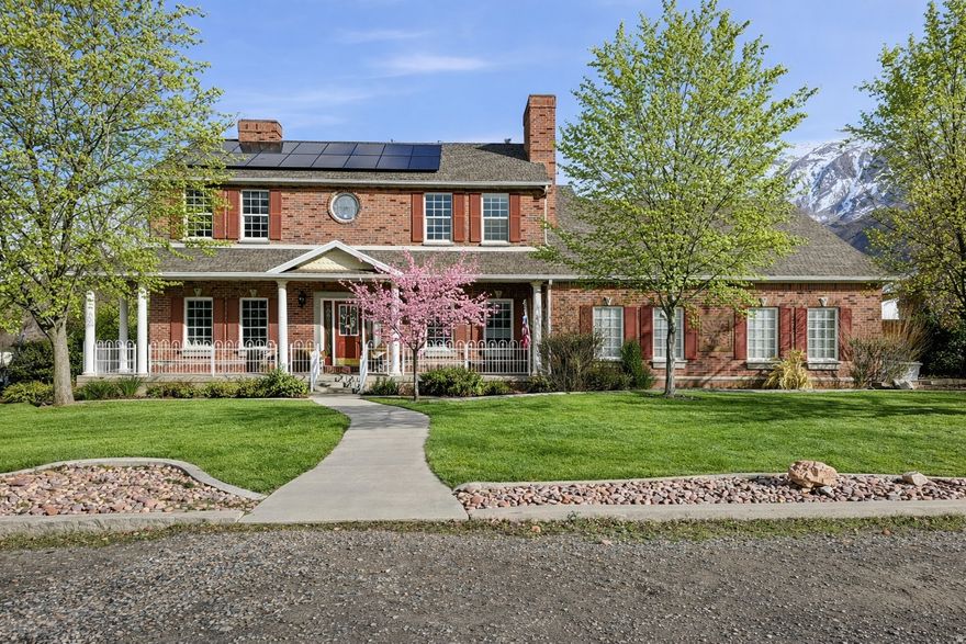 Seller is willing to give a $10,000 credit to buyer. Rare 0.5-Acre Property with Fully Finished 3,200 Sq Ft Warehouse/Shop! This brick 6-bedroom, 3.5-bath home offers space, flexibility, and functionality that's nearly impossible to find. Situated on a fully fenced half-acre lot with mountain views, the property features a fully insulated 3,200 sq ft warehouse/shop complete with plumbing, HVAC, and a half bath-ideal for business use, storage, or creative space. Inside the home you'll find 4,200+ sq ft of living space including a fully renovated basement kitchen, remodeled primary bathroom, updated main-level half bath, restaurant-grade gas stove, new AC unit, and a layout offering versatile living options. The basement includes a separate entrance through the garage, providing excellent flexibility.  Additional highlights include a 3-car garage with extra height, width, and depth, RV/trailer parking, paved sports court, owned active solar with generator and battery, security system, and abundant parking throughout.  Properties with this level of utility, land, and flexibility are rare-don't miss this opportunity. Up for any reasonable offers!