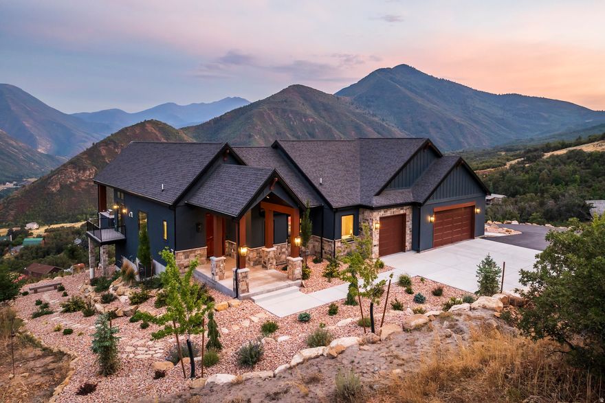 Located near the top of a gated community in Hobble Creek Canyon, this gorgeous home was built in 2022 and features breathtaking panoramic views and year-round mountain living.  The views are so good that sitting on the deck and looking out at the mountains will actually bring peace to your life. They really are incredible! This home is about five minutes from the Hobble Creek Golf Course and it is close to all kinds of recreational opportunities for hiking, biking, and ATV adventures. It's perfect for a primary residence or a vacation property. The roads are plowed in the winter and many families live up here all year. We are selling the home with the adjacent building lot located just below the home. You can build another home, hold it for an investment, sell it, or keep it untouched to preserve your view. The home features an open floor plan with vaulted ceilings, a spacious family room anchored by a fireplace, and a chef's kitchen with quartz countertops, an expansive island, and a bright dining nook framed by sweeping canyon views. The primary suite is really big with a luxurious bath and a huge oversized walk-in closet, while the second bedroom can double as a stylish office with built-ins. The family room and the primary suite open out to a large deck with a built-in outdoor BBQ. The home also has an unfinished basement that offers lots of potential for future expansion. Come up and experience Hobble Creek Canyon. You will never regret it. Did I mention how good the views are!!