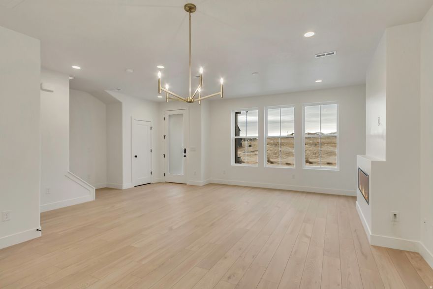 The Solace Floorplan is a welcoming 3-bedroom, 2.5-bath home designed for comfort and connection, offering an open-concept layout with white cabinetry and a cozy fireplace at the heart of the living space. The generous rooftop deck, partially covered, invites you to relax, entertain, or unwind in your own private outdoor oasis. Set within a nature-focused community with 37% open space, residents can enjoy peaceful biking and hiking trails that make coming home feel like a retreat.