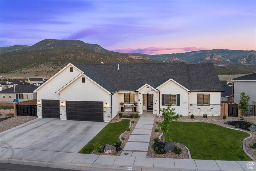 This 4,093 sq ft walk-out residence is ideal for multigenerational living or upscale rental income, with each level offering a full kitchen, living area, laundry hookups, private entrance, and its own AC zone. The main kitchen features a large granite island, hidden walk-in pantry, and premium finishes. Enjoy a gas fireplace with custom cabinetry. Built-in sound systems on both levels, extending outdoors. Additional highlights include a dedicated gym, cold storage/safe room, and a spacious primary suite. Outdoor living offers a large covered deck, lower patio with firepit, and a fully landscaped, fenced yard with custom gates. Experience elevated living in this luxury home with panoramic views. This is an opportunity you don't want to miss. Owner/Agent