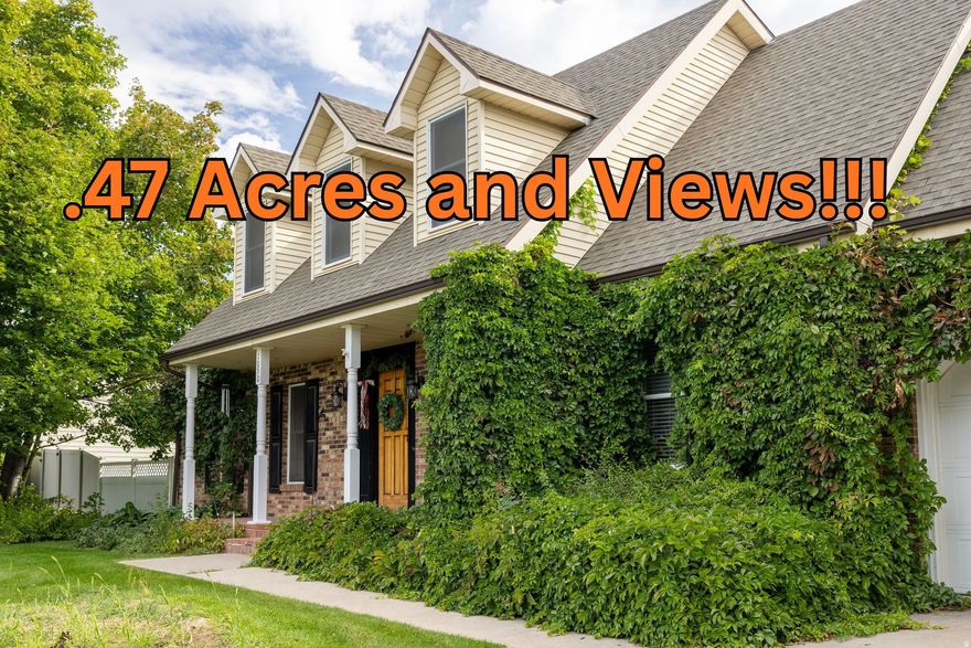 Beautiful 2-story home built in 1983 with classic charm, surrounded by mature vines on nearly a half-acre. Enjoy amazing views of Cache Valley! Remodeled basement with wood stove and great storage. 3 attics! Features include a gas fireplace, step-down family room, new fridge, gas stove, electric oven, new A/C, and new garage door. Fruit lovers will appreciate the apple, pear, and bing cherry trees, plus grapevines, raspberries, blackberries, and rhubarb. Concrete footings under the fence add durability and protection. Great neighborhood, spacious yard, and inviting front porch-this home offers comfort, character, and beauty inside and out! Buyer to verify all. Don't miss the 3D tour