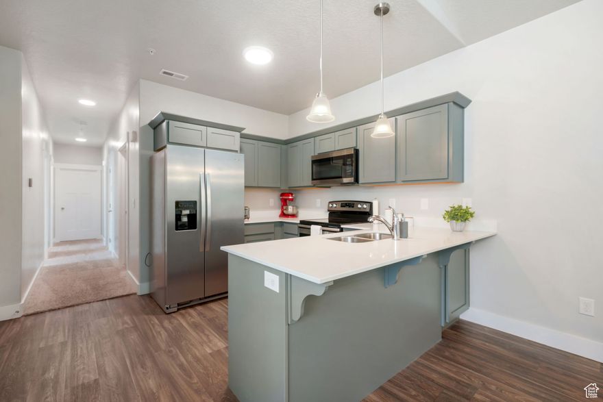 ** Open house 12-3p this Saturday 11/29** Live at the center of it all in this top-floor condo located in Vineyard's sought-after LakeFront community. Just steps from the Utah Lake Shoreline Trail, you'll enjoy daily walks or bike rides with panoramic lake and amazing mountain views, plus breathtaking sunsets from your own balcony. Surrounded by parks, splash pads, and trails, this area is designed for families and outdoor living - all just minutes away. Inside the community, enjoy access to a pool, clubhouse, fitness center, and sports courts, with beautifully maintained green spaces and playgrounds throughout. The home itself features vaulted ceilings, top-floor privacy, and a bright, open layout. You're also minutes from TopGolf, Megaplex Theatres, dining, shopping, I-15, and the FrontRunner - making this an unbeatable location for both lifestyle and long-term value. Whether you're a first-time buyer, investor, or looking for a family-friendly home near it all, this condo delivers the full package.