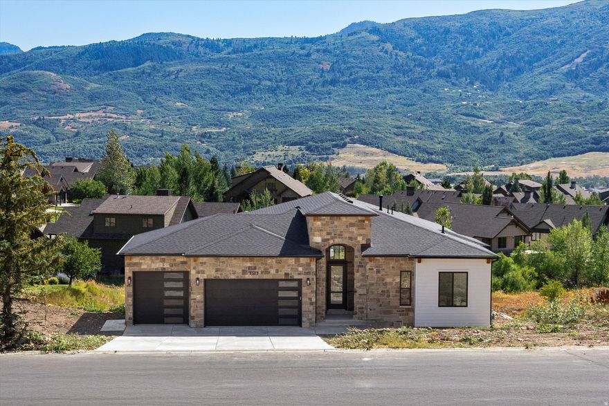 Discover unparalleled luxury and the most impressive views in the Ogden valley with this custom-built Ranch home in Eden, Utah. This one-of-a-kind property boasts commanding views of the Wasatch Mountains, Ben Lomond Peak, Mount Ogden Peak, the Nordic Valley Ski Resort, and Snowbasin ski resort from the moment you walk through the front door. With 14-foot ceilings on the main level and 12-foot ceilings in the massive walk out basement, this open layout and views make this home an extremely unique and impressive property. This home sets a new benchmark for features that every homeowner would ever want or need. Living in a breathtaking mountain setting you will enjoy features such as massive bedrooms with impressive mountain views, a private study or flex room, a huge open kitchen and great room with views, views and more views! The huge, extra deep garage with a Wake boat bay, 9x9 door and 30 feet deep is a rare find. As you step inside, you are greeted by engineered highly durable and waterproof flooring that sweeps through most of the residence. The chef's kitchen is a culinary masterpiece, outfitted with a huge walk-in pantry and premium GE Caf appliances, including a 48" refrigerator, gas cooktop, double ovens and a drawer microwave. This space extends out onto an incredible covered outdoor living/entertaining area complete with an outdoor fireplace. The master suite is a haven of luxury, featuring a designer bathroom, an expansive walk-in closet, private access to the laundry and a private balcony that presents serene views-ideal for unwinding in privacy and comfort. The lower-level impresses with a massive entertainment area complete with more views, a wet bar, two bedrooms, an impressive bath, laundry, cold storage, extra storage, a living room with a separate entrance and an amazing soundproof theater room. This entire space offers great flexibility for extended stay guests or family. The walkout basement area also features a huge covered patio, ready and wired for a future hot tub. This property offers an array of additional luxurious features too numerous to list here, making it a truly exceptional home for those seeking luxury and exclusivity in one of Utah's most desirable locations. This home sits in a recreational paradise, offering direct access to Ogden Valley's extensive trail network, the Wolf Creek Resort golf course, water sports at Pineview Reservoir, and world-class skiing at Snow Basin, Powder Mountain and Nordic Valley. Square footage figures are provided as a courtesy estimate only and were obtained from building plans. Buyer is advised to obtain an independent measurement.