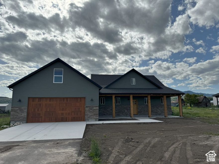 BRAND NEW Expansive views in all directions! Extra large 28x30 garage with utility sink. Bonus living space over garage with private entrance. Custom knotty alder cabinetry with unique leather finish raw edge granite tops. Thanks for showing!