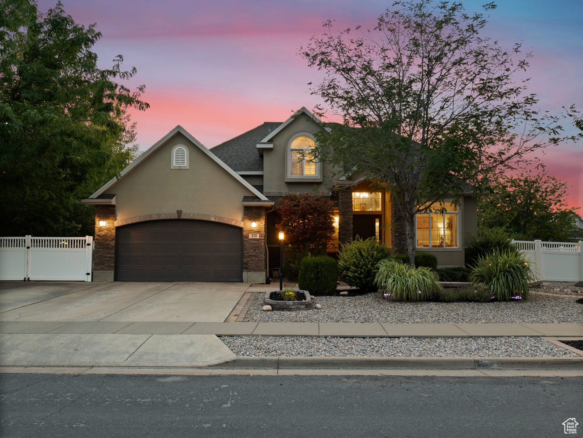 **Experience English Contemporary Elegance in Kaysville** Built in 1998 and completely transformed, this stunning two-story Kaysville residence masterfully blends traditional architecture with the layered aesthetic of English Contemporary design. Situated on a generous .22-acre corner lot, the home's exterior makes an immediate statement with exquisite xeriscape landscaping and a massive 56-foot RV pad along the south side of the property. The backyard is a private sanctuary, featuring an idyllic waterfall, a covered pergola perfect for outdoor dining, a swing set, and an in-ground trampoline. Relax and unwind in the included hot tub -- your personal oasis awaits. Step inside to a professionally curated interior where every detail is intentional. A professional painter and artist collaborated on the design, meticulously selecting every paint color, wall fixture, and light source to create a unique atmosphere that shifts with the time of day. This layered aesthetic is evident everywhere, from the stunning stone arch above the kitchen sink to the elegant tray ceiling in the primary bedroom. Beyond its artistic design, this home is built for modern living with impressive functional amenities, including: A convenient laundry chute; doors that open directly to the backyard oasis; a luxurious primary bedroom with a full en suite with large upgraded shower; and generous cold storage. The sale also includes high-end Samsung appliances, a full entertainment system in the basement, and perfectly organized RGB lighting for the ultimate custom ambiance. Enjoy the ideal Kaysville location with close proximity to a wealth of community features, including stocked fishing ponds, Davis Tech Park, Davis Park Golf Course, and Lagoon Amusement Park. This is a truly special property that must be experienced in person.