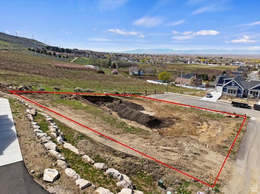 Build your dream home on this stunning lot with breathtaking panoramic views of Willard Bay! Enjoy the perfect blend of privacy and convenience - just minutes to Brigham City and only 25 minutes to Ogden. This lot sits right below BLM land, with direct access to miles of scenic trails right from your backyard. All utilities are already stubbed, including secondary water, and there's no HOA to worry about! The owner chose this special property for its unbeatable location at the end of a quiet dead-end street, bordered by open space and beautiful orchards.