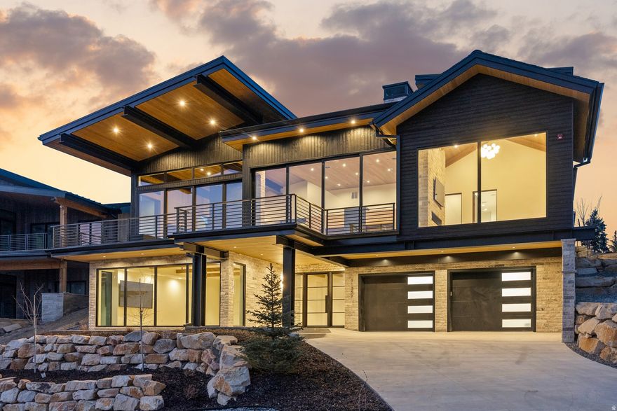 Experience mountain living at its absolute finest in this extraordinary custom residence in SkyRidge, adjacent to the new Deer Valley East Village, one of Park City's most exciting and prestigious new communities.Perfectly positioned to capture arguably the best ski slope views in the area, this home offers a rare vantage point with stunning views of the ski mountain and the lake creating a setting that truly feels almost ski-in/ski out.From the moment you enter, the home makes a dramatic statement.The great room is unforgettable, framed by towering walls of glass that showcase straight-on views of the Deer Valley ski slopes and lake below.Soaring ceilings finished in rich wood, accented by beautiful exposed wooden beams, create a grand yet warm alpine atmosphere, while walls of natural wood elevate the craftsmanship and architectural beauty.The design is world-class, featuring a carefully curated mix of Taj Mahal stone elegant marble, and natural materials applied with exceptional style and grace.The stone exterior flows seamlessly into the interior, creating a cohesive mountain-modern aesthetic that feels both luxurious and timeless.The chef's kitchen is anchored by imported Italian cabinetry, premium appliances, and striking stone surfaces, while the home is grounded by famous Warren Christopher French oak flooring, adding warmth and refined character throughout the living spaces.The primary suite is a true private retreat featuring a massive 300s/f dream closet along with a separate secondary closet within the suite for added convenience and organization.Designed for both comfort and entertainment the home includes TVs in every room highlighted by two massive 100-inch screens plus whole-home surround sound and integrated speakers for a fully immersive experience.This is a rare opportunity to own a statement home in SkyRidge, combining breathtaking ski and lake views, exceptional architecture and extraordinary craftsmanship in one of Park City's finest community.