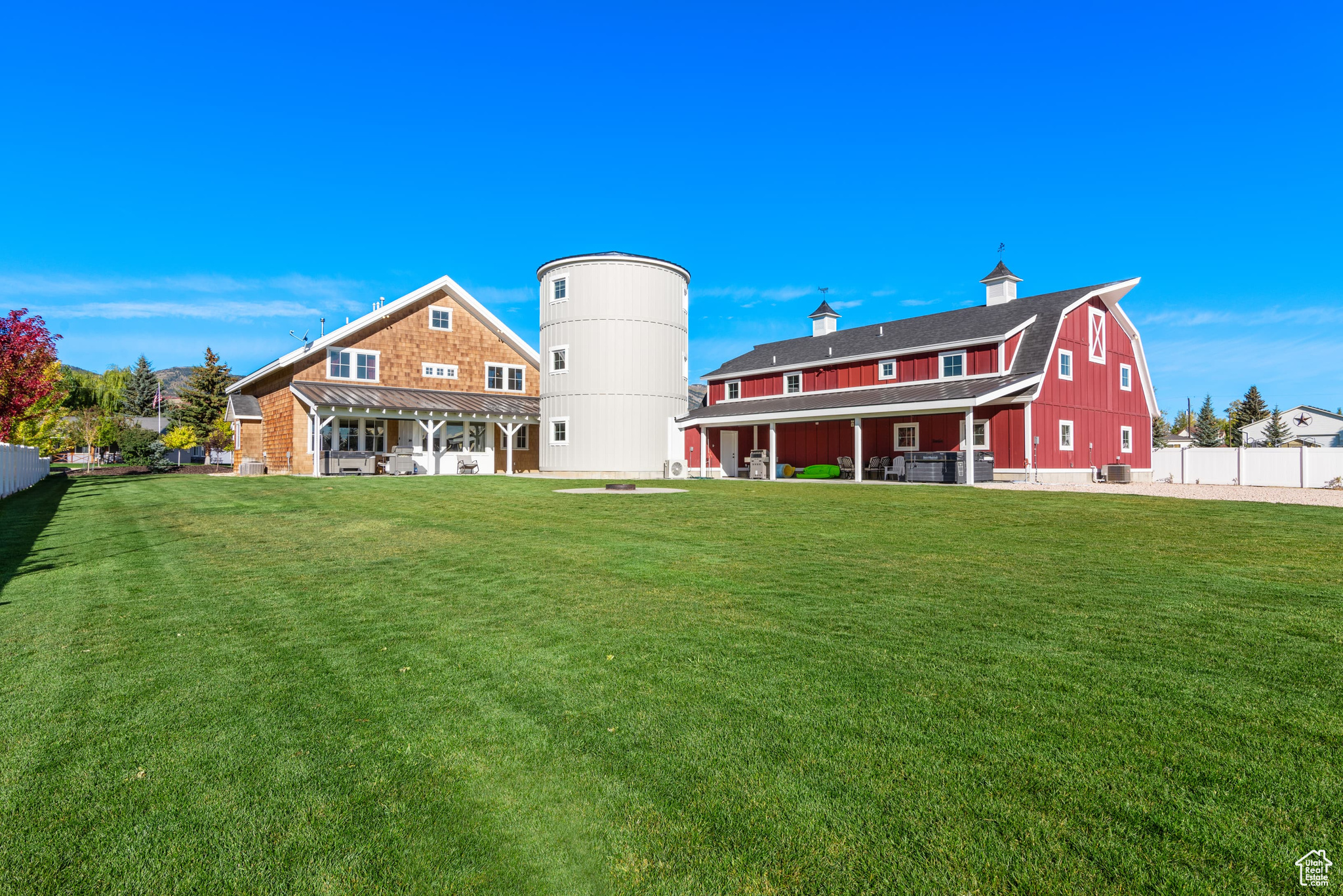 We've recently adjusted the price to make this home an even better value-come take a look! Incredible Short-Term Rental Opportunity in the Heart of Garden City! Sits on 1 acre, this unique property features a Farmhouse, Barnhouse, and Silo, each thoughtfully designed to attract guests and ensure repeat bookings. Sold together, these two expansive homes offer a combined 8,945 sq ft of living space, including 10 bedrooms, 9 bathrooms, and two oversized great rooms with spacious kitchens and dining areas-perfect for large groups. With four dedicated laundry areas, this property is both convenient and impressive. Accommodating up to 80 guests or offering the option to rent the homes separately, this property is ideal for both small and large gatherings. Enjoy the outdoors with ample space, including two patios, two hot tubs, a fire pit, a 23x26 shop, and a 6-car shed. There's plenty of parking, including space for boats and toy trailers. Fully self-managed, this turnkey investment includes established VRBO, Airbnb, and Google Business accounts with 5-star ratings, integrated marketing, booking, and management software (https://bearlakesilo.com/), and all in place to streamline operations. The sale also includes all furniture, furnishings, linens, a fully equipped kitchen setup, and a complete Smart Home system for remote management. With existing bookings already generating income, this property is ready to go. Don't miss out, contact your Realtor to schedule a showing today!