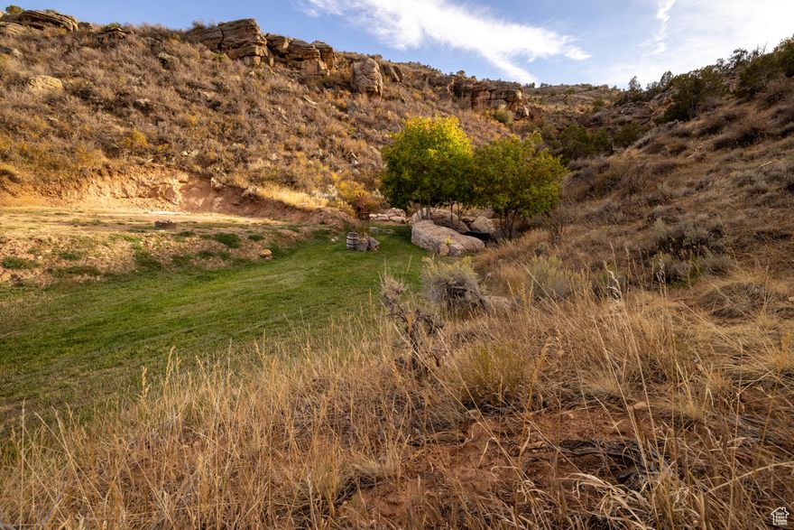 This 6.65 acre parcel is surrounded by the natural beauty of Dry Fork Canyon, offering stunning views and a peaceful environment nestled in a cove. This parcel is ready to build, water well drilled in 2020, electrical and septic system already in place with an additional 50 amp electrical hookup.  Buyer to verify all information.