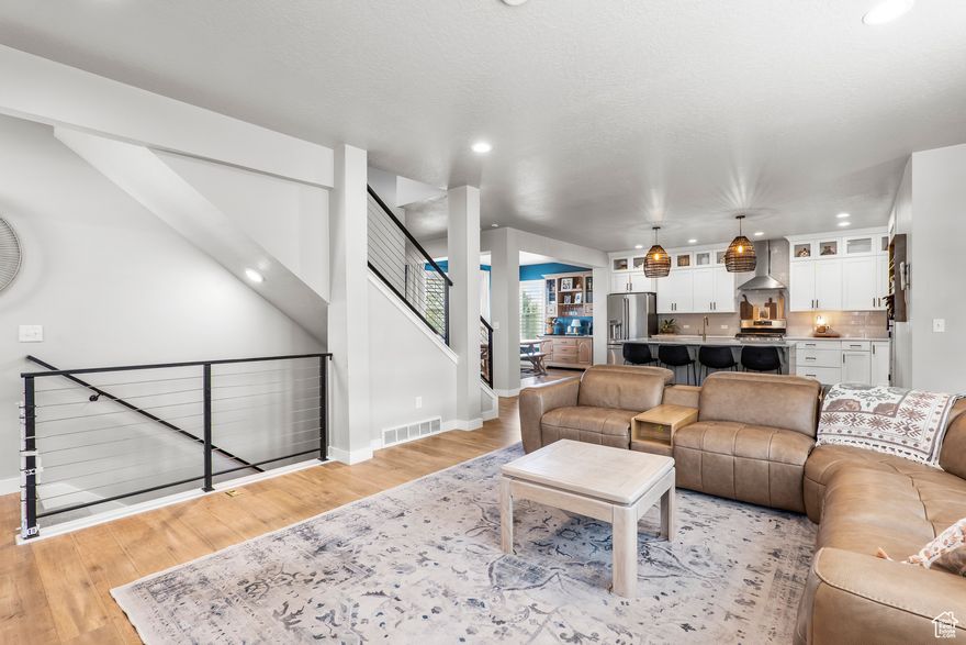 Why wait for a New Build when you can move into a quiet, established neighborhood NOW.  Walking distance to the new Cove House, Watercourse, and Daybreak's largest park (Highland Park). An entertainer's dream with a spacious, easy-to-navigate main floor and an incredible backyard featuring a large patio under a massive 20'x20' pergola surrounded by mature trees. Interior highlights include plantation shutters, an open floor plan, office with built-ins and a metal sliding door, and a spacious mudroom. Rare four-bedroom layout upstairs with custom closet organization. The modern kitchen features custom cabinetry, pull-out drawers, custom pull-outs in the pantry for convenient storage and optimal space, and upper and under cabinet lighting. The finished basement offers two living areas, a built-in dry bar, LVP flooring, and additional storage. The extended-depth two-car garage provides space for long-bed trucks or extra gear. Classic architecture, modern function, and exceptional outdoor living come together in this rare Daybreak find. Owner/Agent.