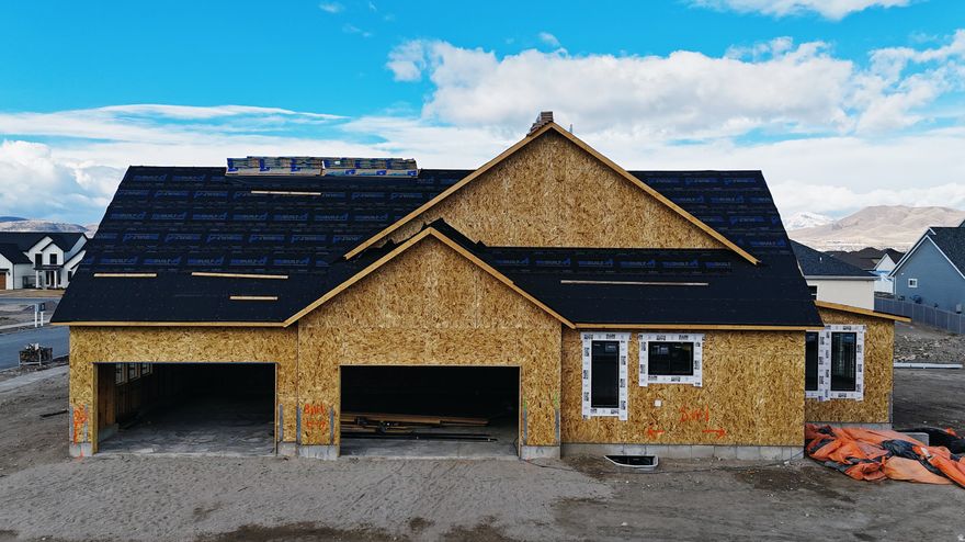 The Holly floor plan in our exclusive South Creek neighborhood. This one-of-a-kind, south-facing home sits on the largest lot in the community and features a side-load four-car garage, offering both curb appeal and exceptional functionality. Designer styling is carried seamlessly inside and out, including a covered deck off the primary suite that connects to the main deck off the dining area-perfect for entertaining and enjoying the expansive backyard. The yard offers ample space for a pool, pickleball court, or additional shop/garage. The home showcases top-tier appliances, including a Sub-Zero refrigerator/freezer combination and a 48" Wolf gas range. Inside, you'll find generous main-floor gathering spaces, while the primary closet is truly a work of art. A thoughtfully curated selection of exquisite finishes completes this exceptional residence. Call today to schedule your private showing.