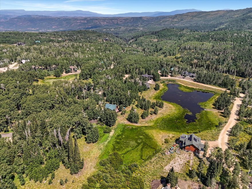 Welcome to 4403 Fawn Way, an exceptional opportunity to own a premier homesite in the highly sought-after upper section of Timber Lakes. This unique property offers unparalleled privacy, bordered on three sides-north (HOA owned), east (common area), and south (HOA owned) ensuring natural separation from neighboring lots and no new development near this property. Enjoy direct access to a scenic meadow and lake just to the east, perfect for hiking, picnicking, and outdoor recreation in the summer. In the winter, this same area transforms into a haven for snowshoeing and snowmobiling. The lot's ideal location ,near the snowmobile gate, also provides quick access to thousands of acres of National Forest land-right from your doorstep. The property features a beautiful mix of mature pine and aspen trees, and is mostly flat with a gentle slope to the south, making it both picturesque and practical for building. Whether you're looking to build your dream mountain retreat or secure a serene getaway spot, this lot offers the perfect balance of privacy, access, and natural beauty. Don't miss this rare opportunity to own one of Timber Lakes' most desirable parcels.