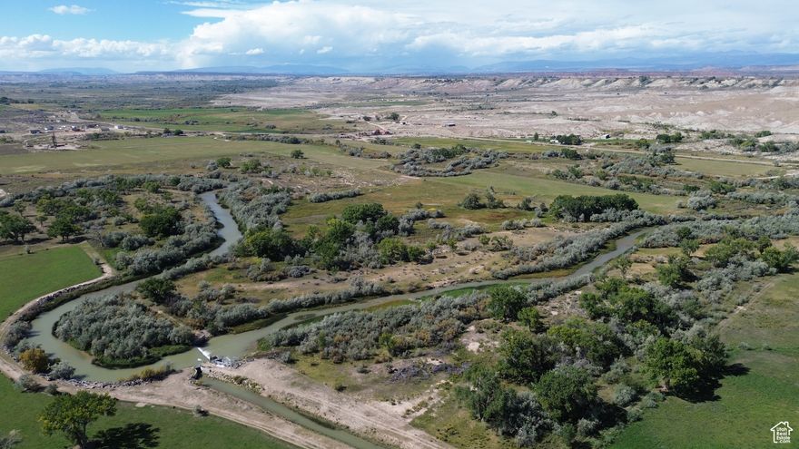 39.31 riverfront acres located less than two miles NE of Myton, UT  1,990 feet of Duchesne River frontage for prime brown trout fishing Zoned A-5 (Agriculture - 5-acre minimum lot size) Duchesne County parcel 00-0007-5253 Taxes: $252.56 6000 West ends 0.73 miles south of SE property corner No subsurface, oil, gas, or mineral rights included in offering One share of BIA water for flood irrigation on 16.9 acres (#N6944) 7 miles northeast of Bridgeland, Utah 15 miles northeast of Duchesne, Utah 100 miles east of Salt Lake City, Utah