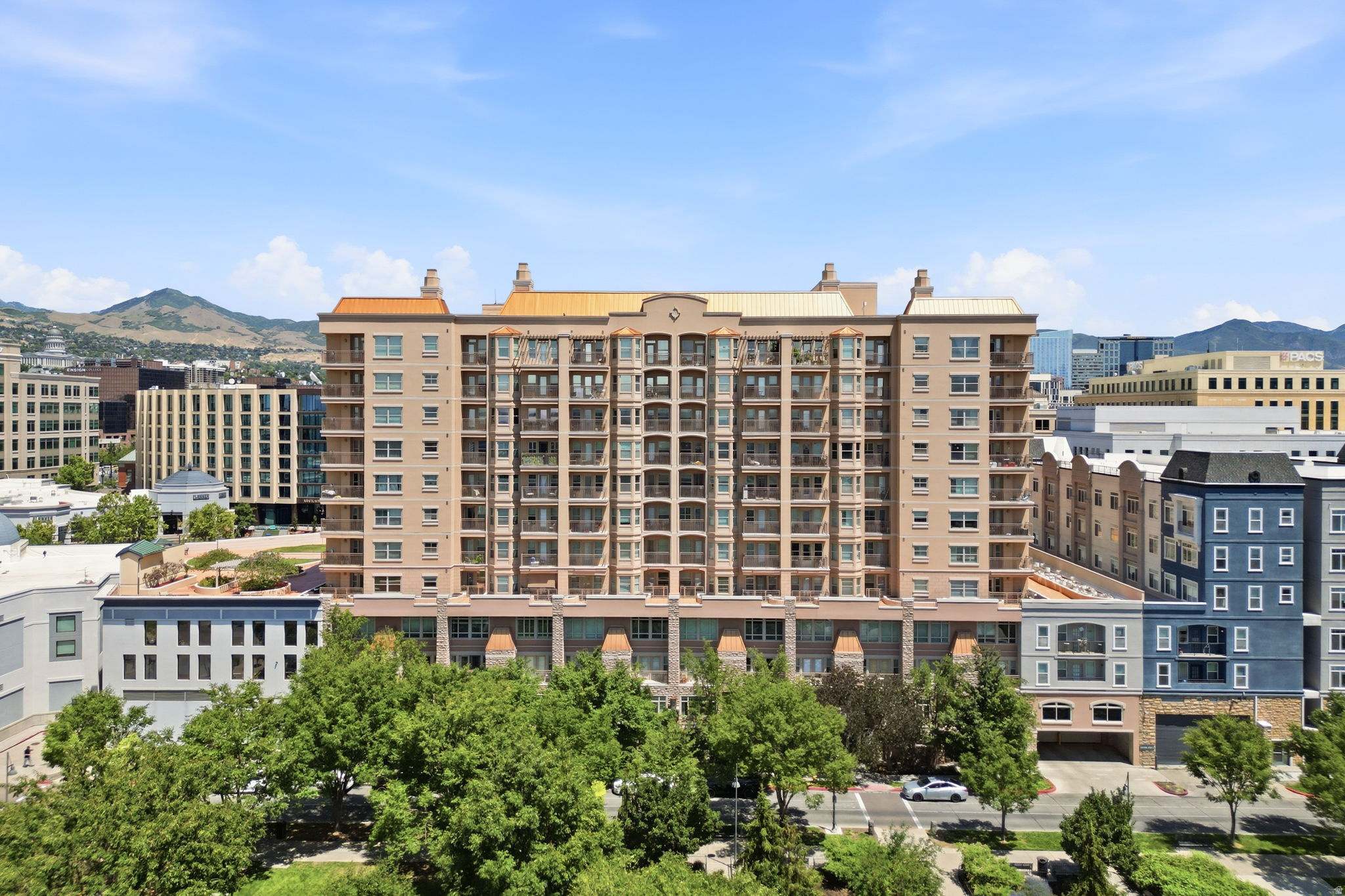 Multi-story building featuring numerous balconies and a traditional facade
