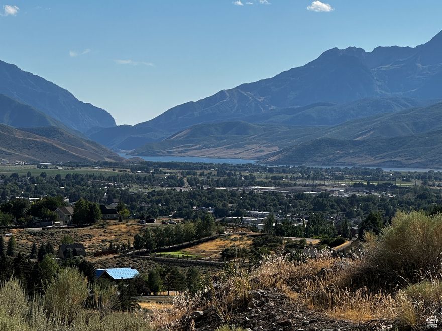Views,  Views! Located in beautiful and private Wasatch View Acres, this property boast amazing views of the Heber Valley, Deer Creek Reservoir and Mt. Timpanogos.  Come build your dream home, hobby farm or weekend getaway! Super convenient location yet private and tucked away, this is an easy drive into Heber, Park City, and SLC Intl Airport, not to mention an outdoor enthusiasts paradise.  This 10 acres includes a deeded easement with newly upgraded asphalt driveway.  Art Studio located on property is being relocated and doesn't convey. PLEASE CALL AHEAD TO SCHEDULE AN APPOINTMENT FOR ALL VIEWINGS AS A COURTESY TO ADJACENT NEIGHBORS and get more information on this amazing opportunity to own a piece of paradise! 1615 E 1950 N. (Lot 6) Heber, City tax ID 00-0004-0563 is being sold with the listing address and tax ID above for a total of 10 acres.  Property image website : https://listings.tammietyczphotography.com/sites/jnkpazj/unbranded