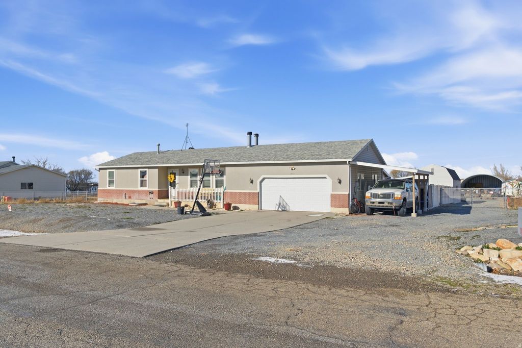 Photo of 1955 S STONEY MOUNTAIN DR, Lake Point, UT 84074 (MLS # 2130376)