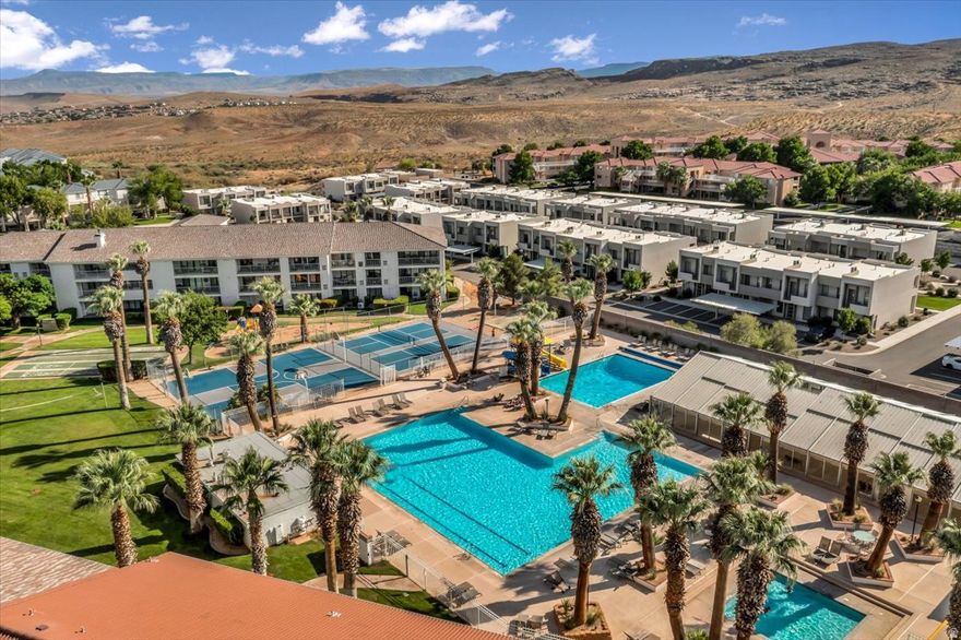 Vacation vibes, resort views, and income potential all in one turnkey Las Palmas condo.  Welcome to this top-floor 3-bedroom, 2-bath condo in the highly desirable Las Palmas resort community, where the views and location make all the difference.  Positioned overlooking the resort pools, spa, clubhouse, and recreation areas, this unit delivers the kind of atmosphere buyers and guests are actually searching for that unmistakable "I'm on vacation" feeling from the moment you arrive.  Unlike many units tucked deeper into the community, this condo is easy to access and conveniently located near the entrance with simple parking and a straightforward walk up.  Inside, the 1,092 sq ft floor plan is comfortable, functional, and fully furnished for immediate enjoyment or rental use. The kitchen features updated cabinetry, stylish backsplash, farmhouse sink, updated fixtures, and included appliances. Washer/dryer, furnishings, TVs, linens, cookware, dishes, and essentials are all included, making this a true turnkey opportunity.  The layout offers excellent flexibility with 3 bedrooms and 2 full baths, including a private primary suite with ensuite bath. A standout feature: both rear bedrooms offer sliding door access to the patio, creating seamless indoor/outdoor enjoyment and a true resort-living feel.  Additional highlights include: Top-floor location, Resort amenity views, Detached one-car garage, Fully furnished, Stackable washer/dryer included, Short-term rental approved area...  Las Palmas is known for its exceptional resort amenities, including pools, fitness facilities, pickleball, basketball, clubhouse spaces, and recreation areas --- all just minutes from hiking, golf, shopping, dining, Sand Hollow State Park, Zion National Park, and everything Southern Utah has to offer.  Whether you're looking for a personal getaway, full-time escape, or investment opportunity, this one delivers location, lifestyle, and flexibility.