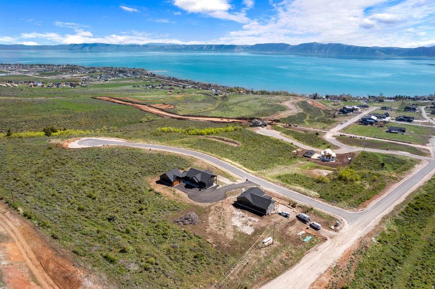 Stunning Bear Lake View Lot  .81 Acres with easy Year-Round Access on paved roads! Enjoy breathtaking panoramic views of Bear Lake from this spacious .81-acre corner lot. Located in a prime position, this property offers year-round access and is ideal for building your dream home, vacation retreat, or income-producing short-term rental. Surrounded by natural beauty, you'll have endless recreational opportunities right at your doorstep-whether it's boating and swimming in the lake or hiking and exploring the nearby mountains. Experience the best of both worlds with unmatched lake and mountain adventure! No HOA.