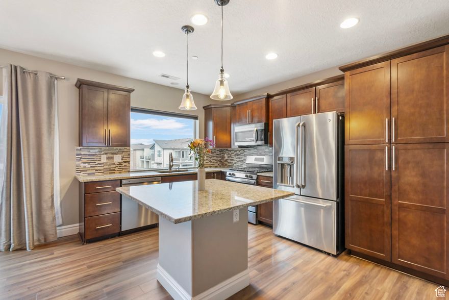 **Open house this Saturday February 21st 11am - 1pm**  Discover this beautifully designed townhome offering breathtaking views and an unbeatable location near Station Park. Just a short walk from top-tier dining, shopping, and entertainment, this home blends convenience with modern elegance. Inside, you'll find granite countertops, sleek stainless-steel appliances, and a gas range-perfect for cooking and entertaining. Thoughtfully positioned to maximize natural light and scenic views, this home also boasts ample guest parking, making hosting effortless. Enjoy a low-maintenance lifestyle with access to a nearby community pool, or stay active on the scenic trails ideal for biking and running. Don't miss the opportunity to make this exceptional townhome your own!  Square footage figures are provided as a courtesy estimate only and were obtained from county records.  Buyer is advised to obtain an independent measurement.