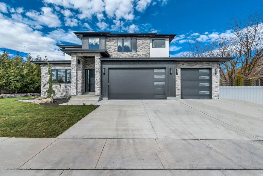 Don't miss your opportunity to own this exceptional custom home in one of South Jordan's most desirable neighborhoods! Thoughtfully designed for both elegance and function, this spacious residence offers 7 bedrooms, 6 bathrooms, and a 4-car garage, making it the perfect sanctuary for modern living. This home features a private, tree-lined yard, creating a peaceful setting ideal for entertaining or relaxing. Inside, you'll find luxurious finishes and generously sized gathering areas with a seamless flow for hosting and everyday life. The open floor plan is highlighted by two main floor offices, perfect for working or learning from home. The deluxe accessory dwelling unit (ADU) is an incredible bonus, offering full functionality for multigenerational living or income potential, complete with its own separate access and stylish design. Additional highlights include: A dedicated exercise room, a rec room with a wet bar and theater space for ultimate entertainment, high-end finishes and custom details throughout, and mature trees providing privacy and natural beauty. This home has been expertly designed for both luxury and everyday convenience.